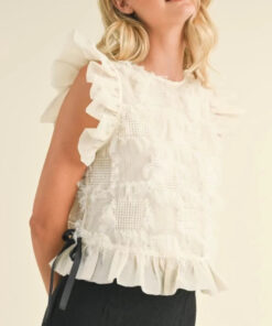 Cream ruffle top with black details